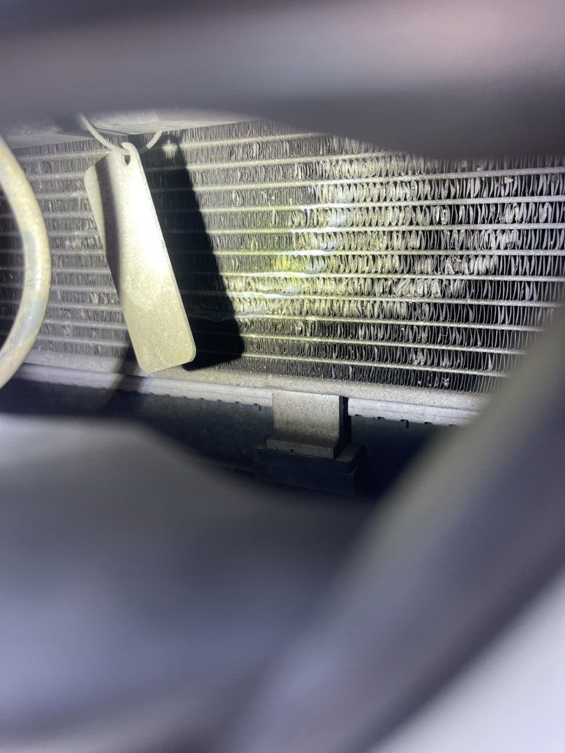 A Close Up of a Radiator on a Car With a Fan — Cool Cats Auto Air in Urangan, QLD