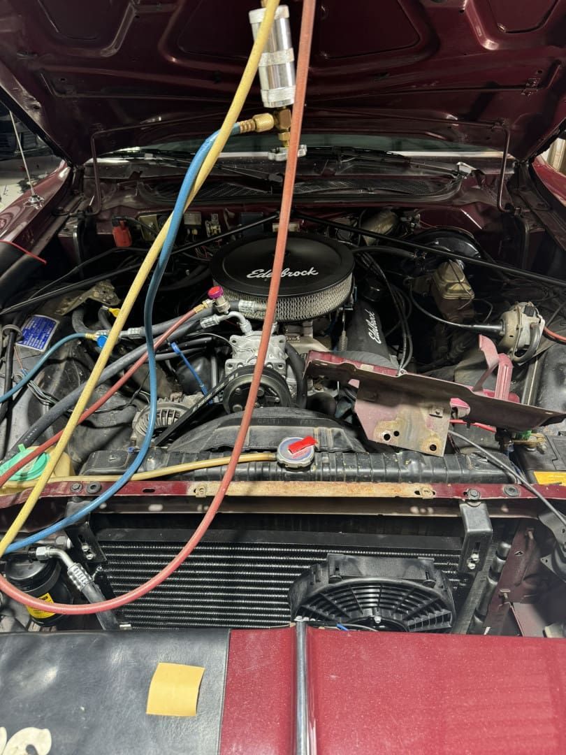 A Car Engine is Being Worked on by a Mechanic — Cool Cats Auto Air in Urangan, QLD