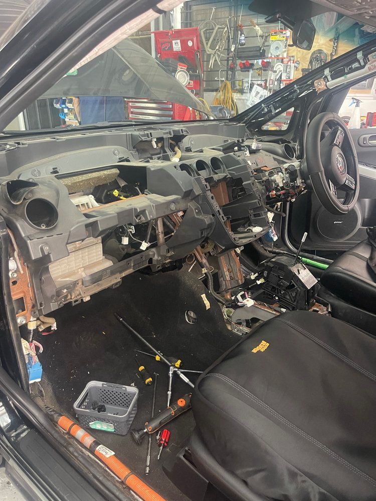 The Interior of a Car is Being Dismantled in a Garage — Cool Cats Auto Air in Urangan, QLD
