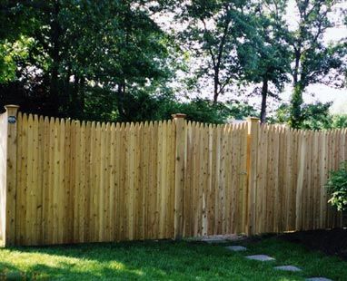 Stockade with round cedar posts