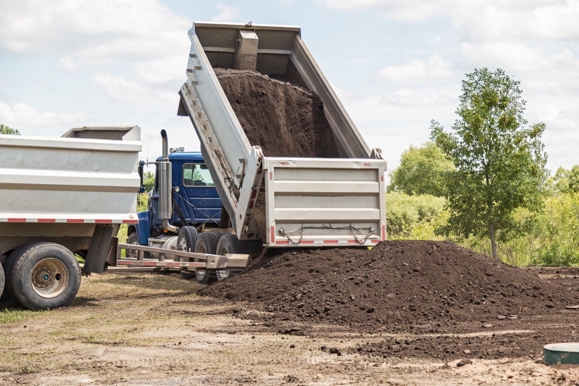 Truck Dumping Soil — Rome, NY — Colucci Trucking Truck Dumping Soil — Rome, NY — Colucci Trucking