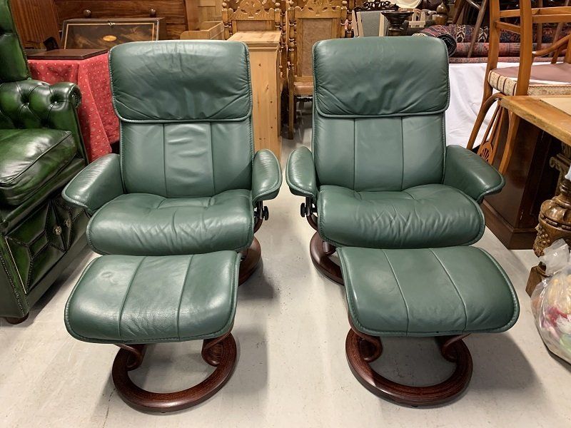 A Pair of Large Ekornes Reclining Armchairs & Footstools