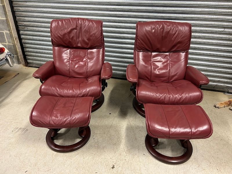 A Pair of Large Ekornes Savannah Reclining Leather Armchairs & Footstools