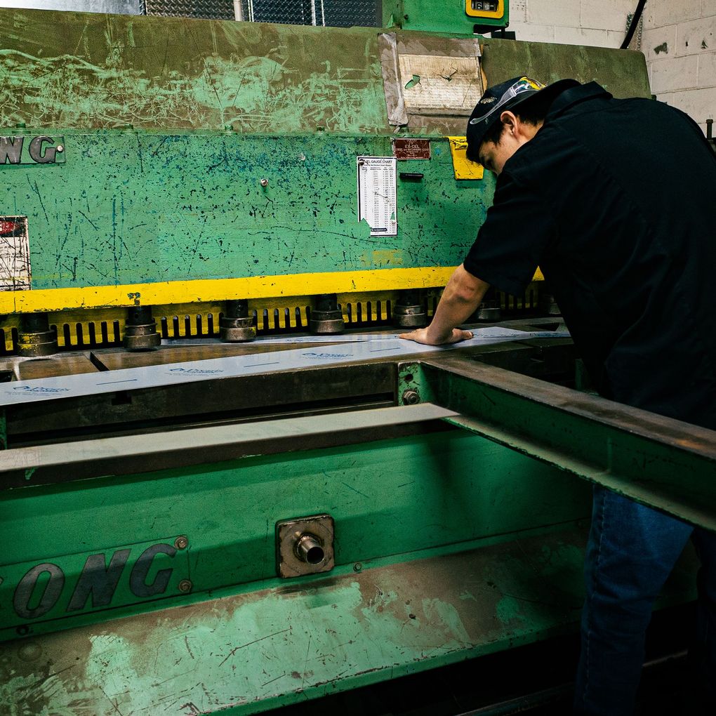 Photo of Integrus Fab Team member operating a pres-brake