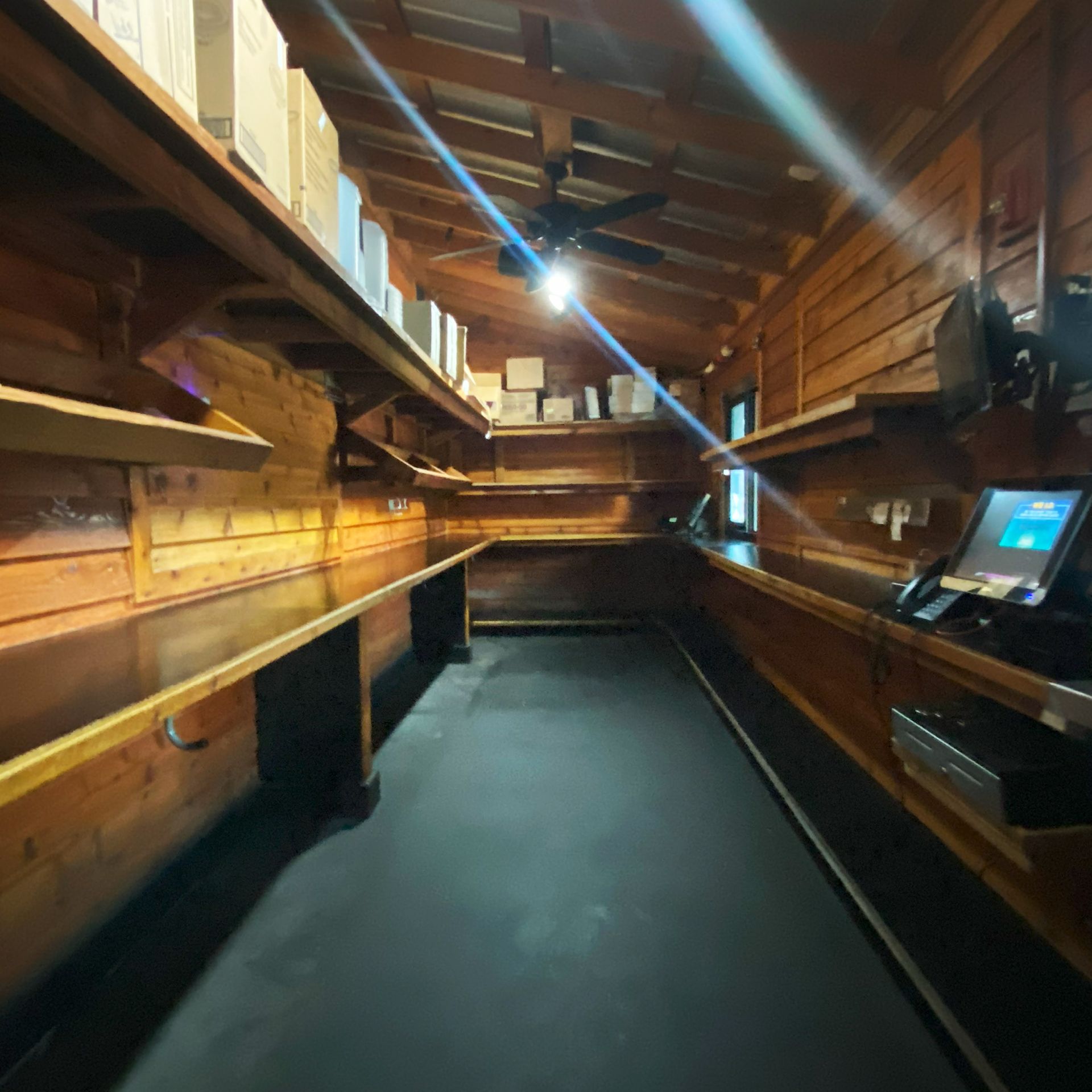 Before Image of Texas Roadhouse To-Go Room with wooden shelves