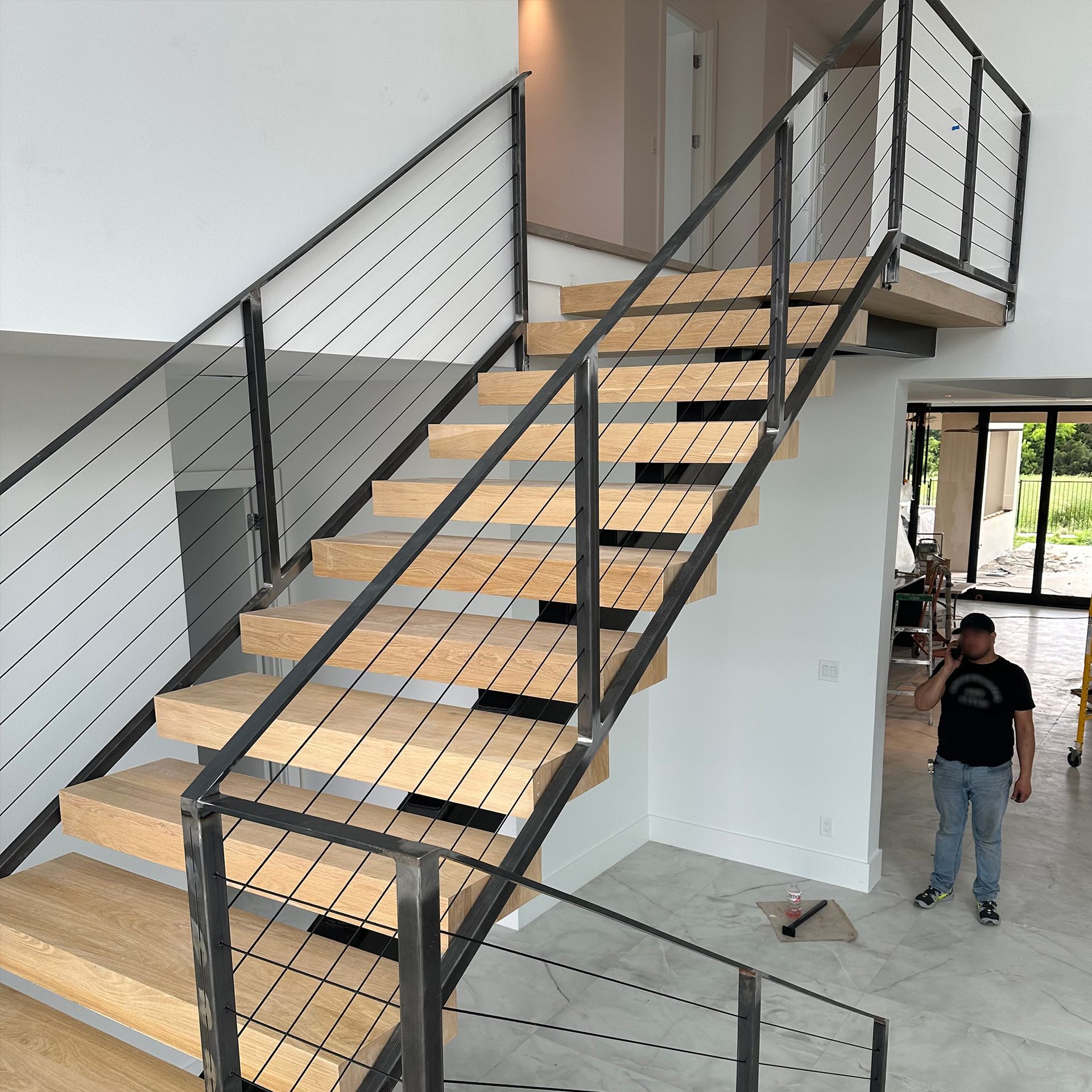 Photo of steel cable staircase installed by Integrus Fabrication