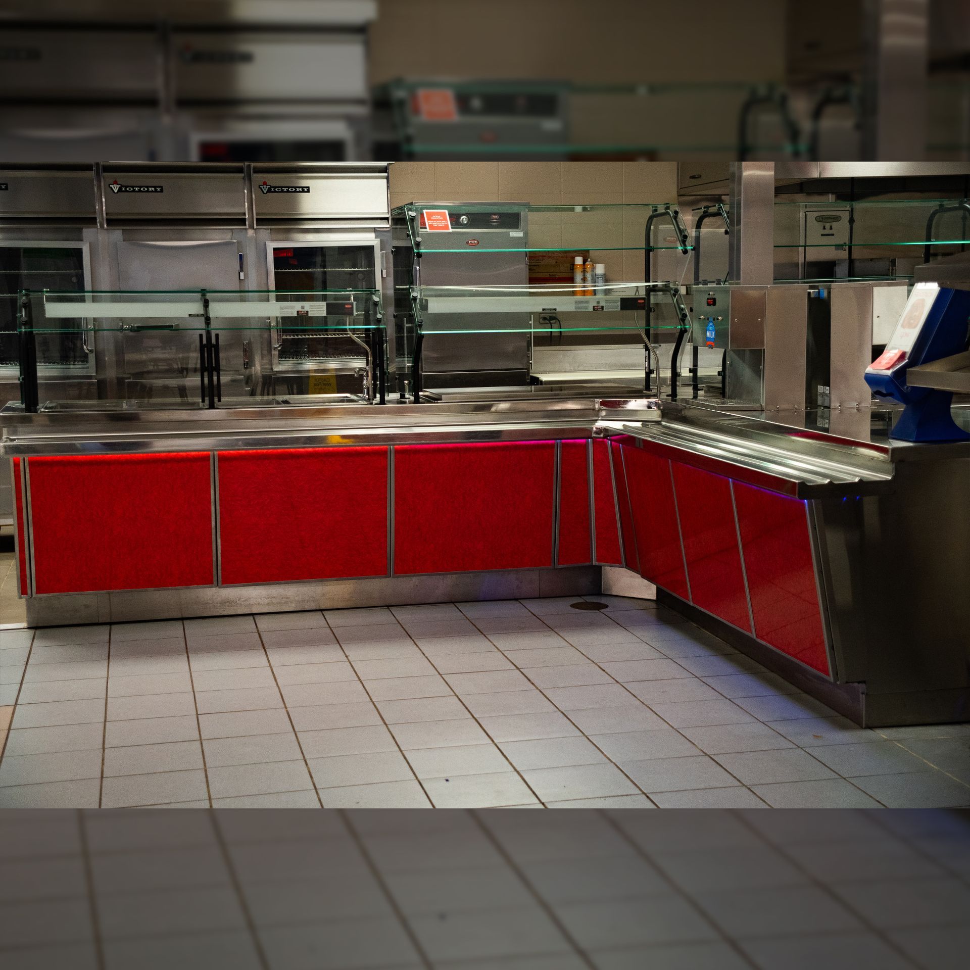 Photo of Cafeteria Serving Line installed by Integrus Fab at a public school with Red Stainless Panels