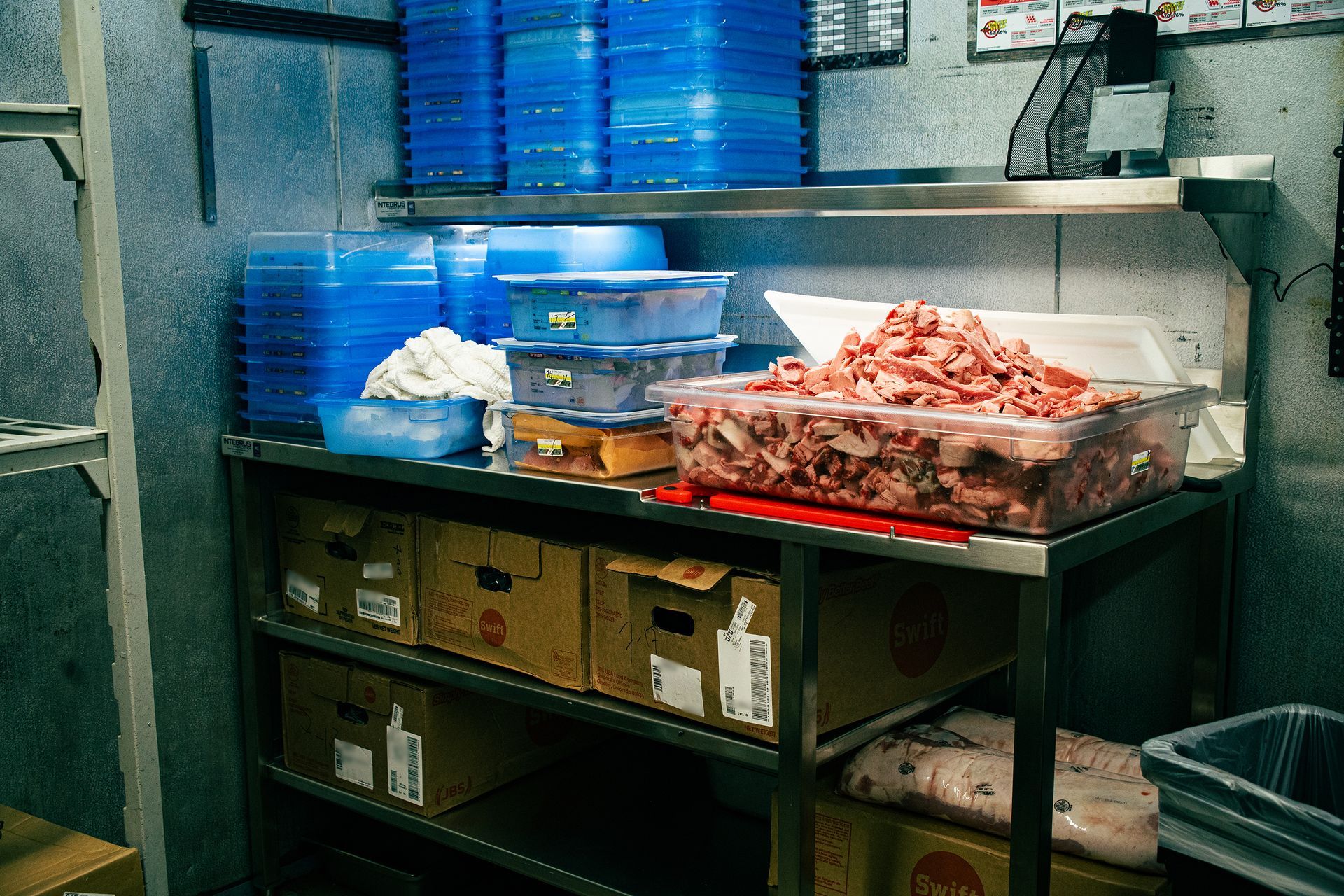 Photo of meat cutting table with supplies on it