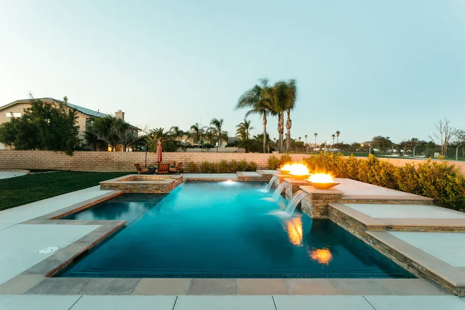 Geometric pool with fire features Geometric pool with fire features