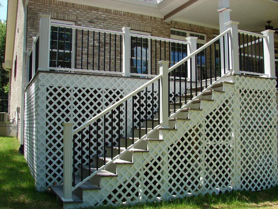 Front porch with stairs leading up to the front door.