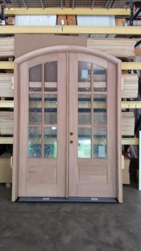 Large wood double doors in a warehouse.