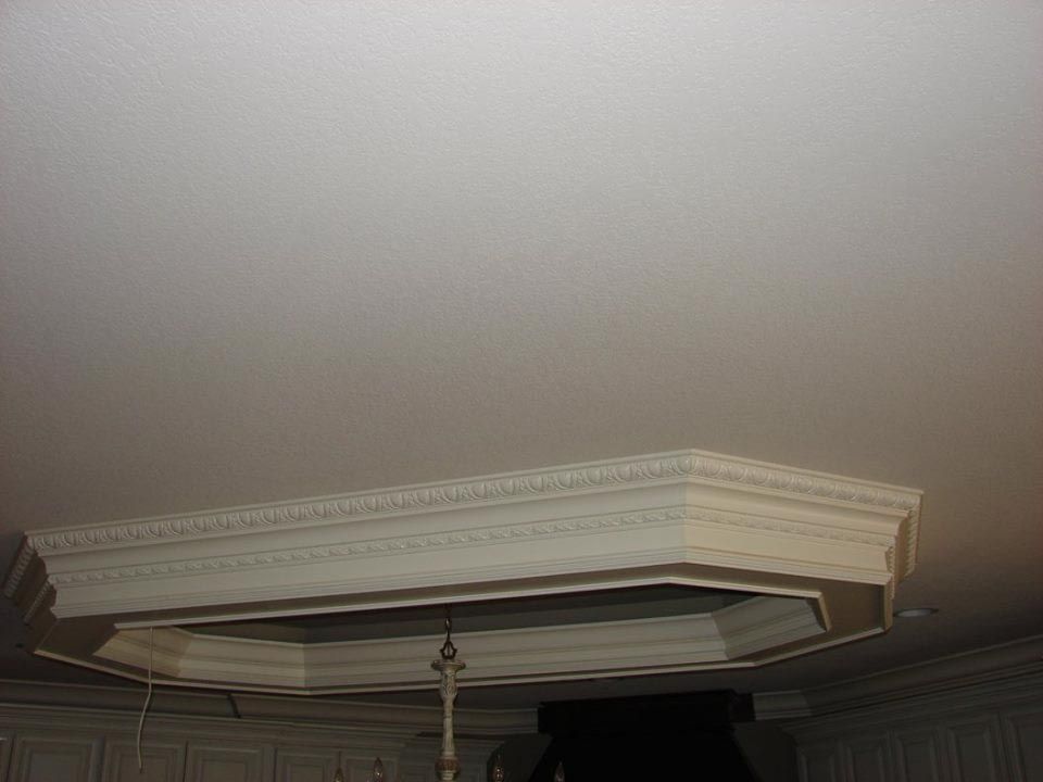 White octagonal ceiling trim. A fixture hangs below.