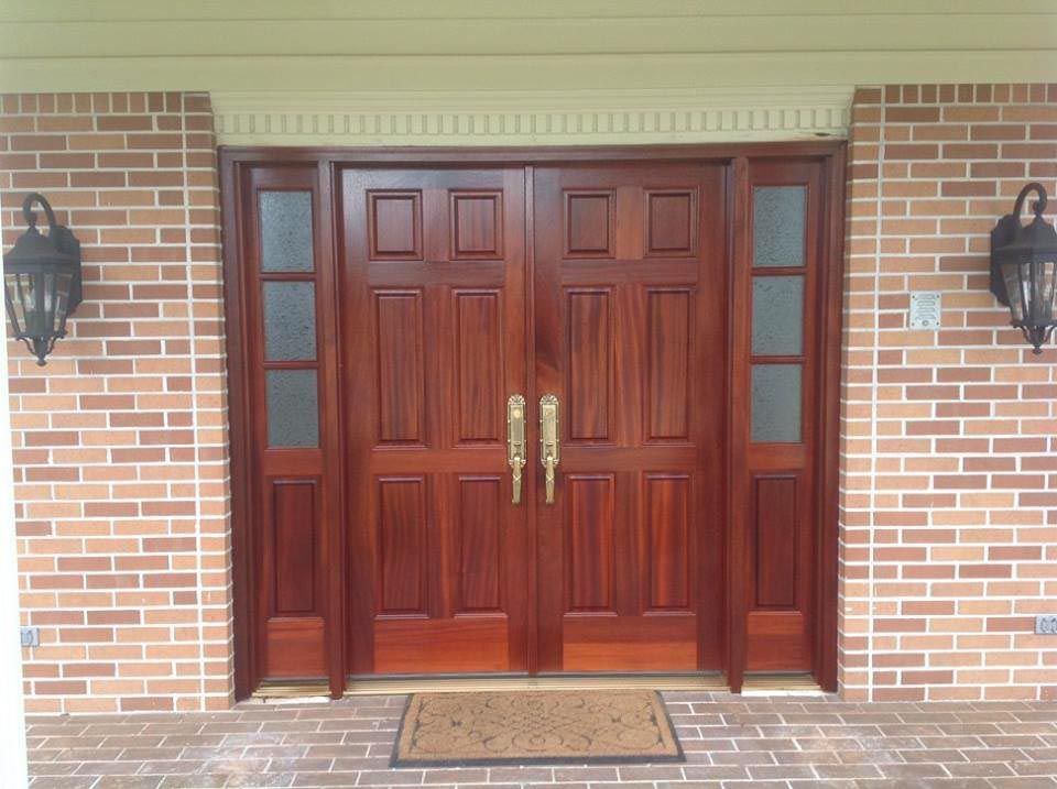 Solid wood exterior doors with three glass window panes on each side.