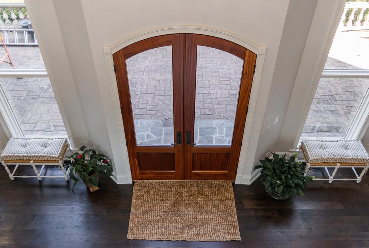 Ariel view of entry way exterior wood double doors.