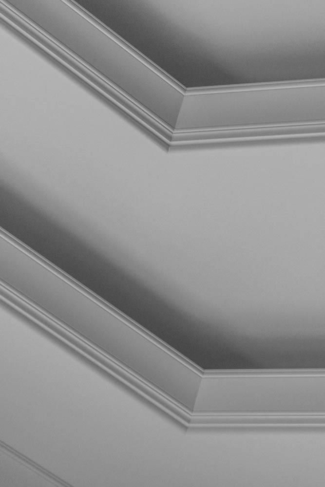 Angled ceiling with decorative crown molding.