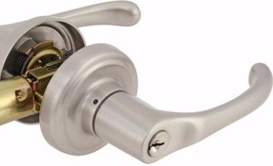 Silver door lever, partially disassembled, showing internal mechanisms.
