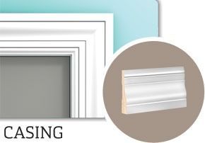 White casing molding around a gray doorway, with a close-up of the molding profile.