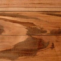 Close-up of three horizontal wood planks with varying shades of brown and natural grain patterns.