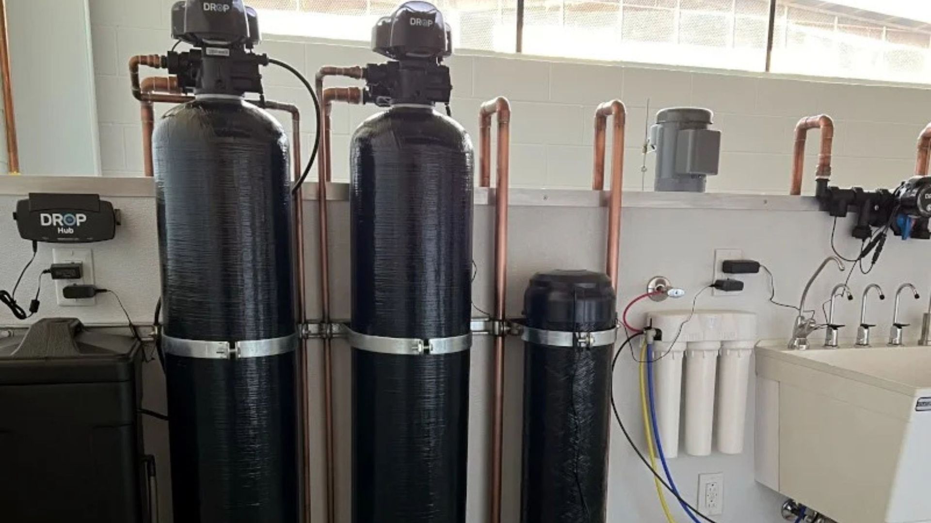 A water treatment system is installed in a room.