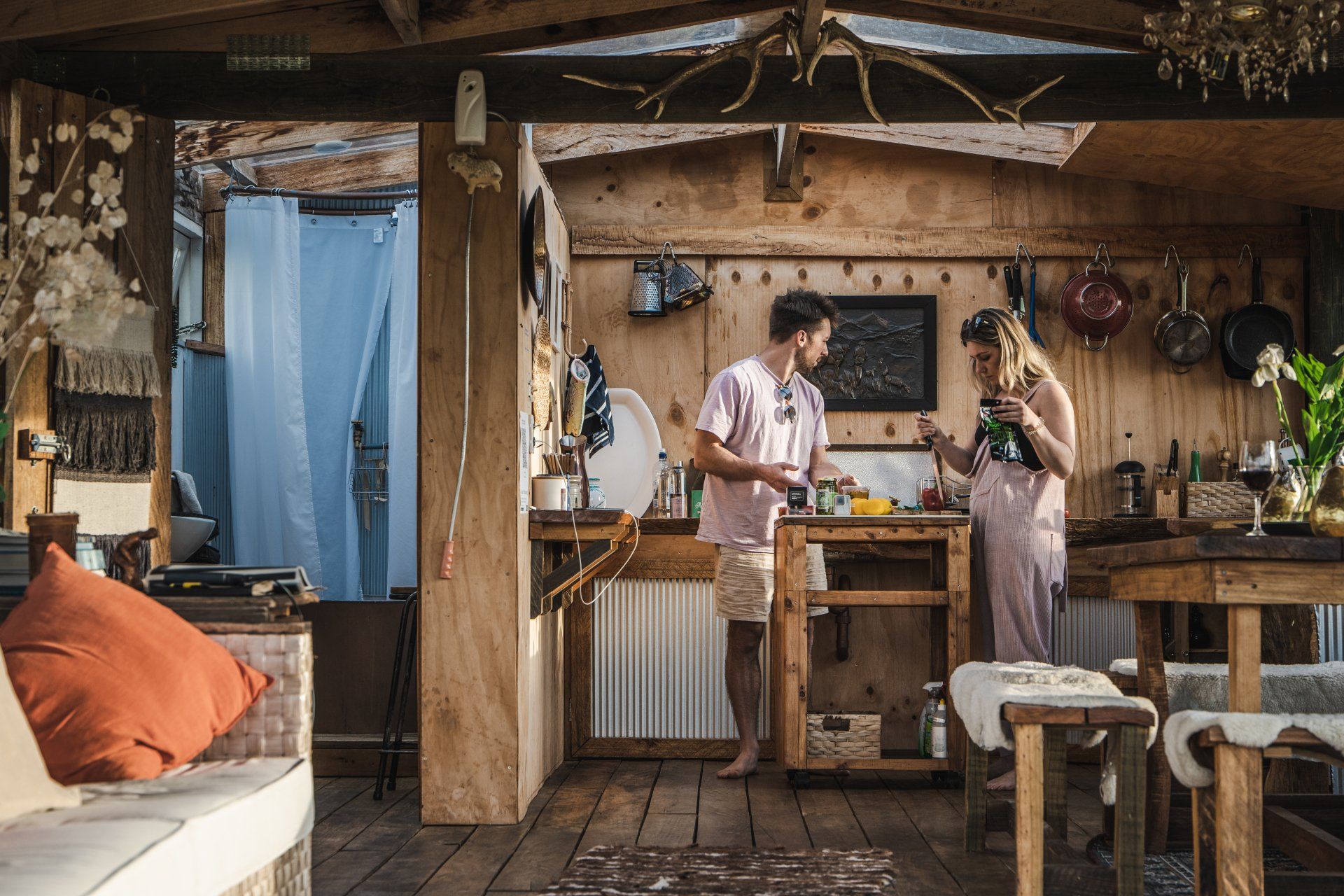 A man and a woman are standing in a kitchen