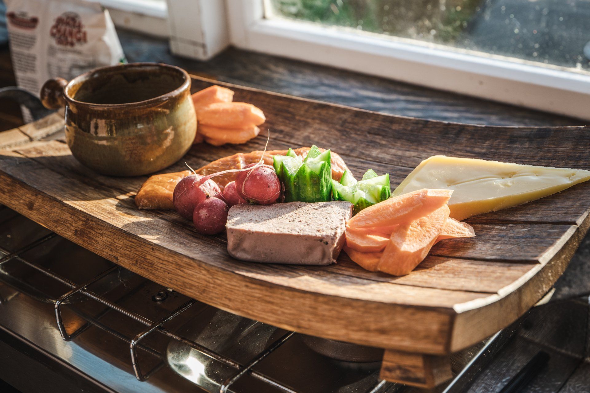 A wooden cutting board with a variety of food on it
