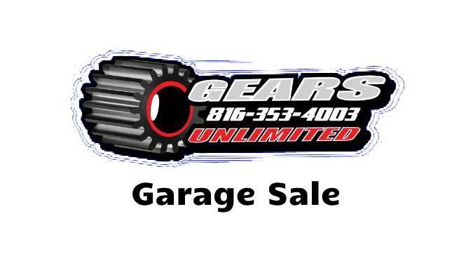 A logo for a garage sale with a tire on it.