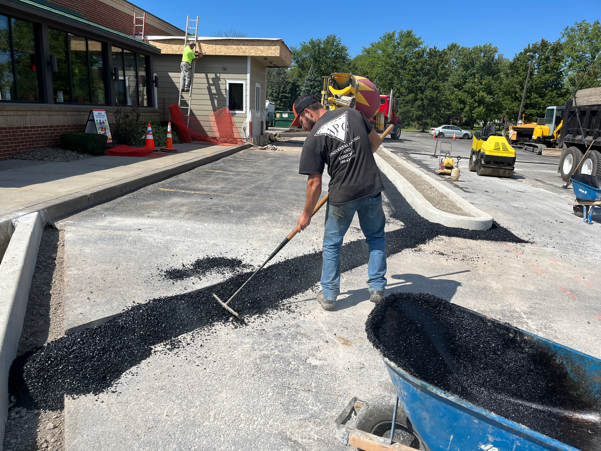 Universal Paving & Concrete completing a commercial paving project in Rochester, NY, with a focus on quality, precision, and long-term performance.