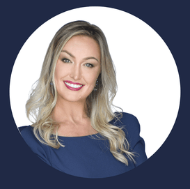 A woman in a blue dress is smiling in a circle