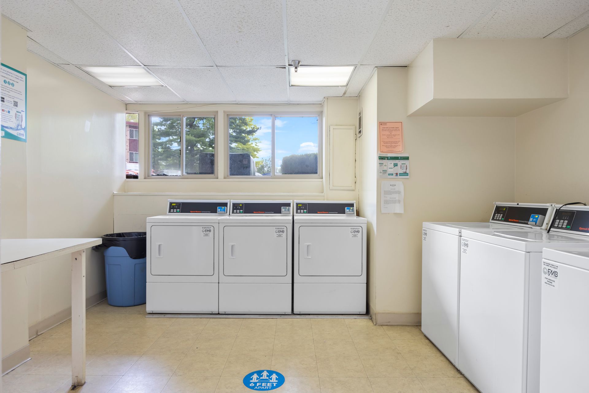 A laundromat with a lot of washers and dryers