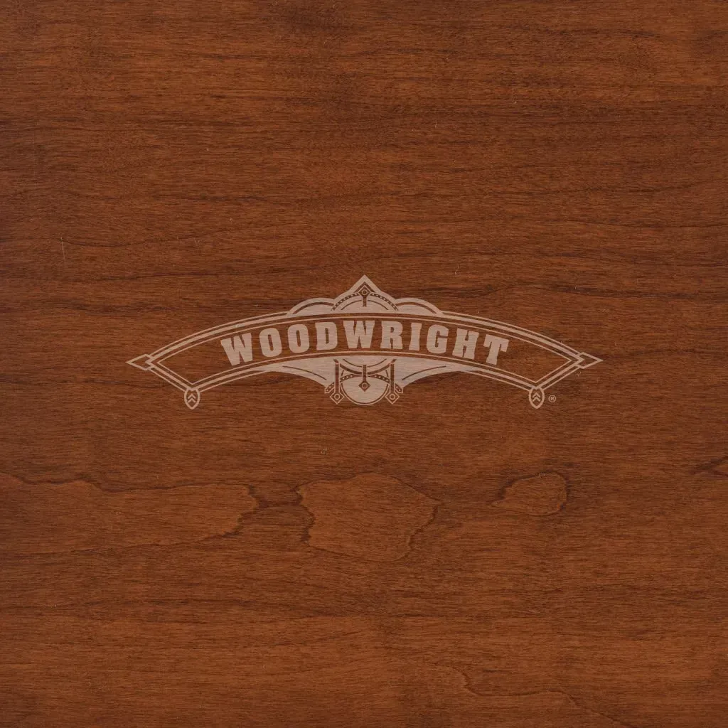 Woodwright logo on a dark wood grain background.