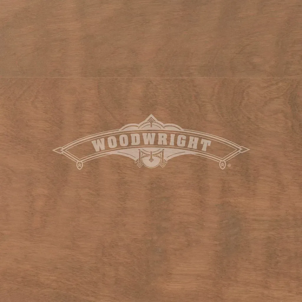 Woodwright logo in light color on a brown woodgrain background.