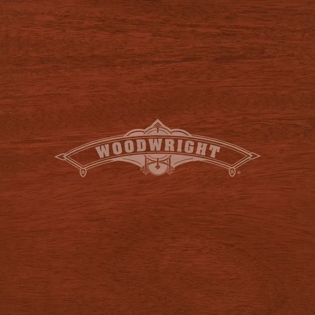 Woodwright logo on a dark brown wood background.