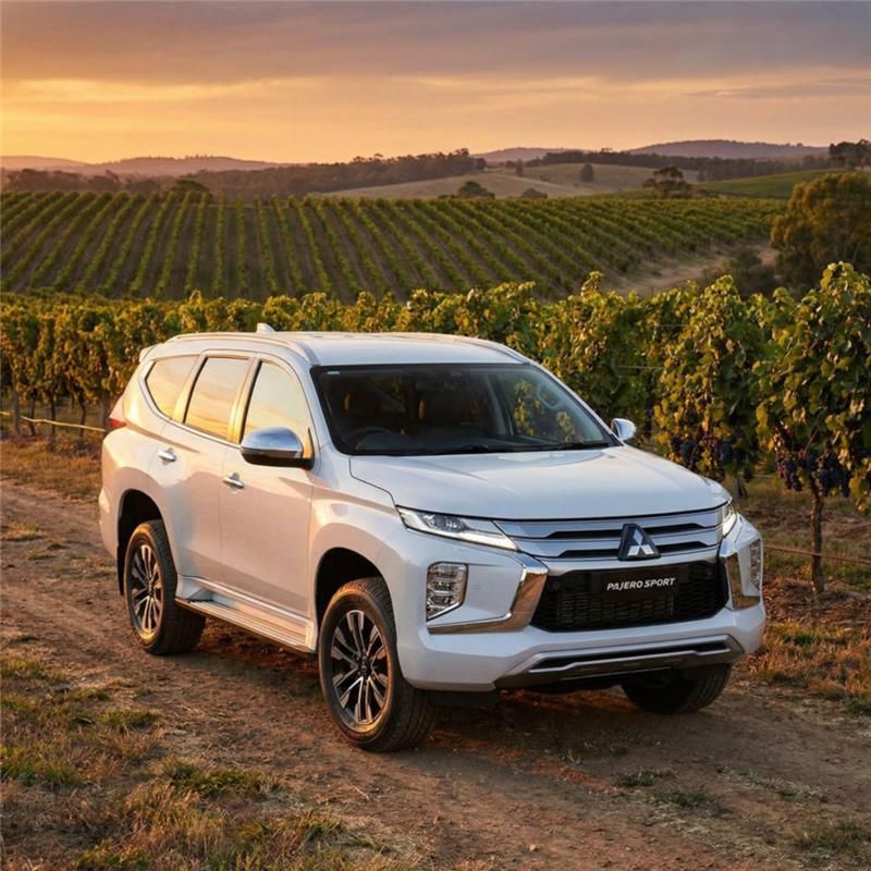 A White Mitsubishi Pajero Sport SUV Parked — Mudgee Passenger Transport in Mudgee, NSW