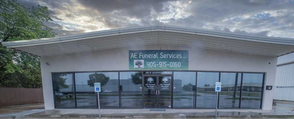 the front of a building with a sign that says `` ae funeral services '' .