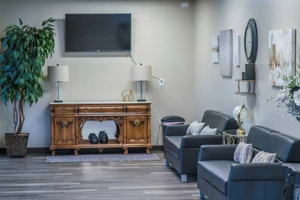 a living room filled with furniture and a flat screen tv .