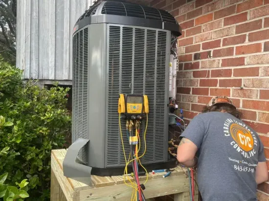 CTC technician installing an outdoor HVAC unit