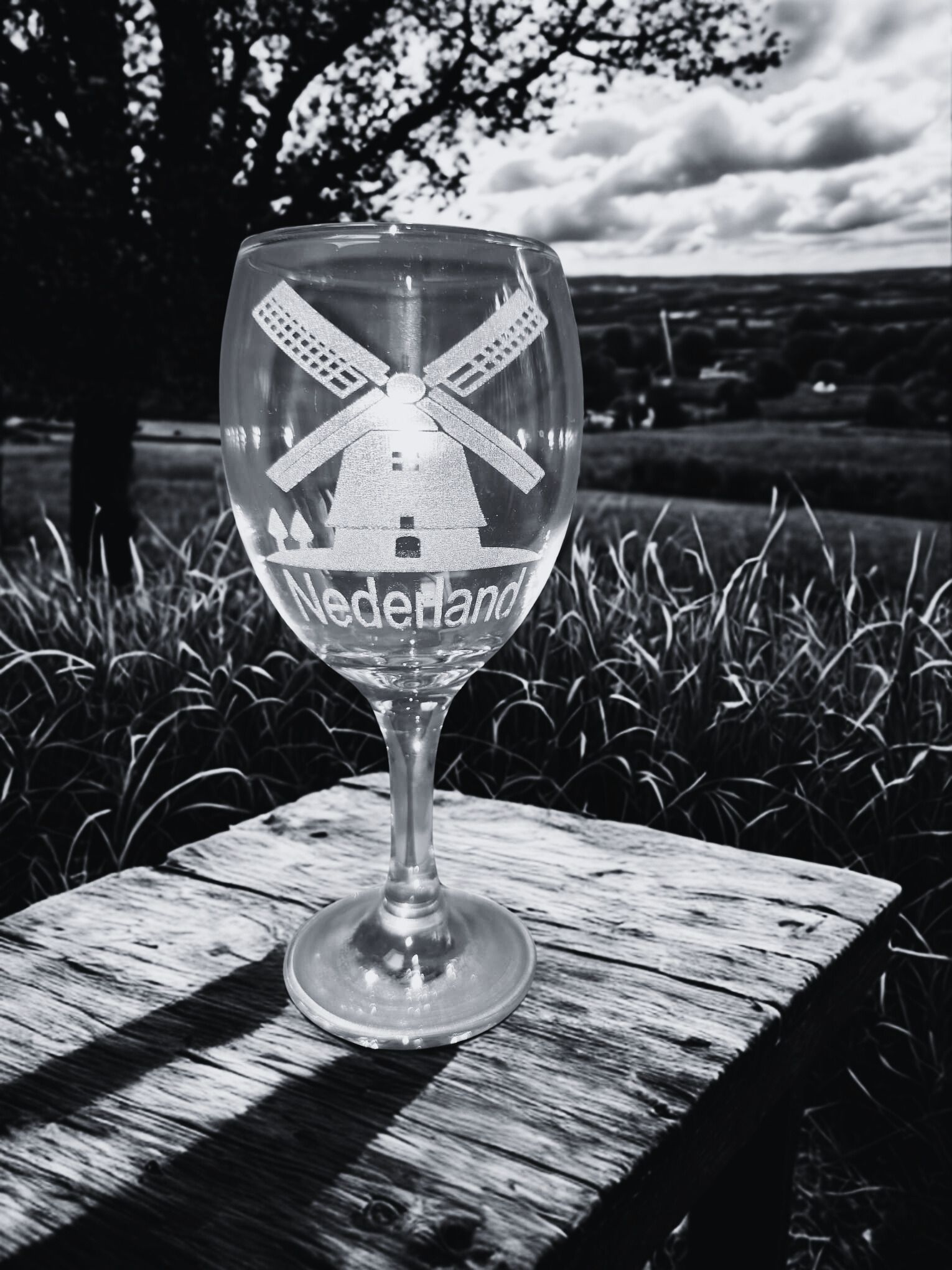 Wine glass etched with a windmill and 