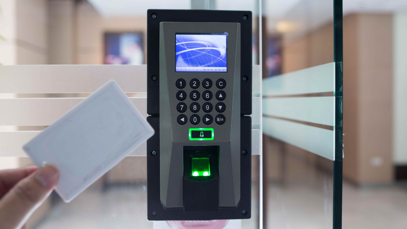 A close up of a keypad on a door.