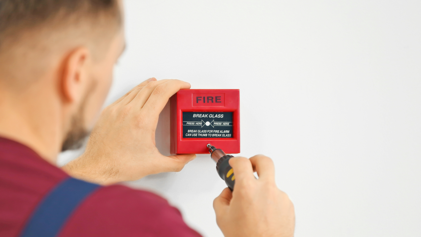 A person is using a smart card to open a door.