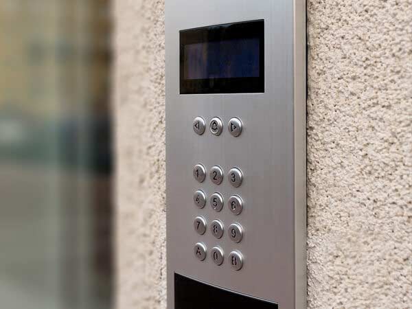 A close up of a doorbell on a wall.