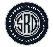 San Roman Development circular logo in navy, white, and silver with stylized SRD initials