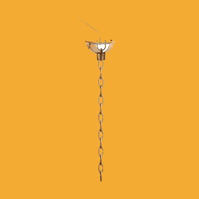 A pendant light with a chain hanging from it on a yellow background.