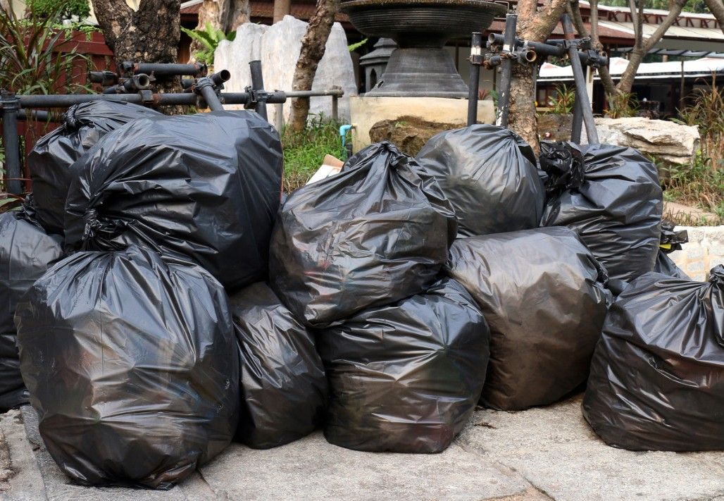 Black bags full or general rubbish ready for collection by J&Z House Clearance Cardiff