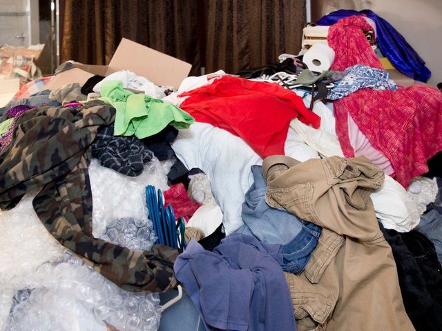 Large clothing pile in a hoarder's house in Cardiff, ready for collection by J&Z House Clearance Cardiff