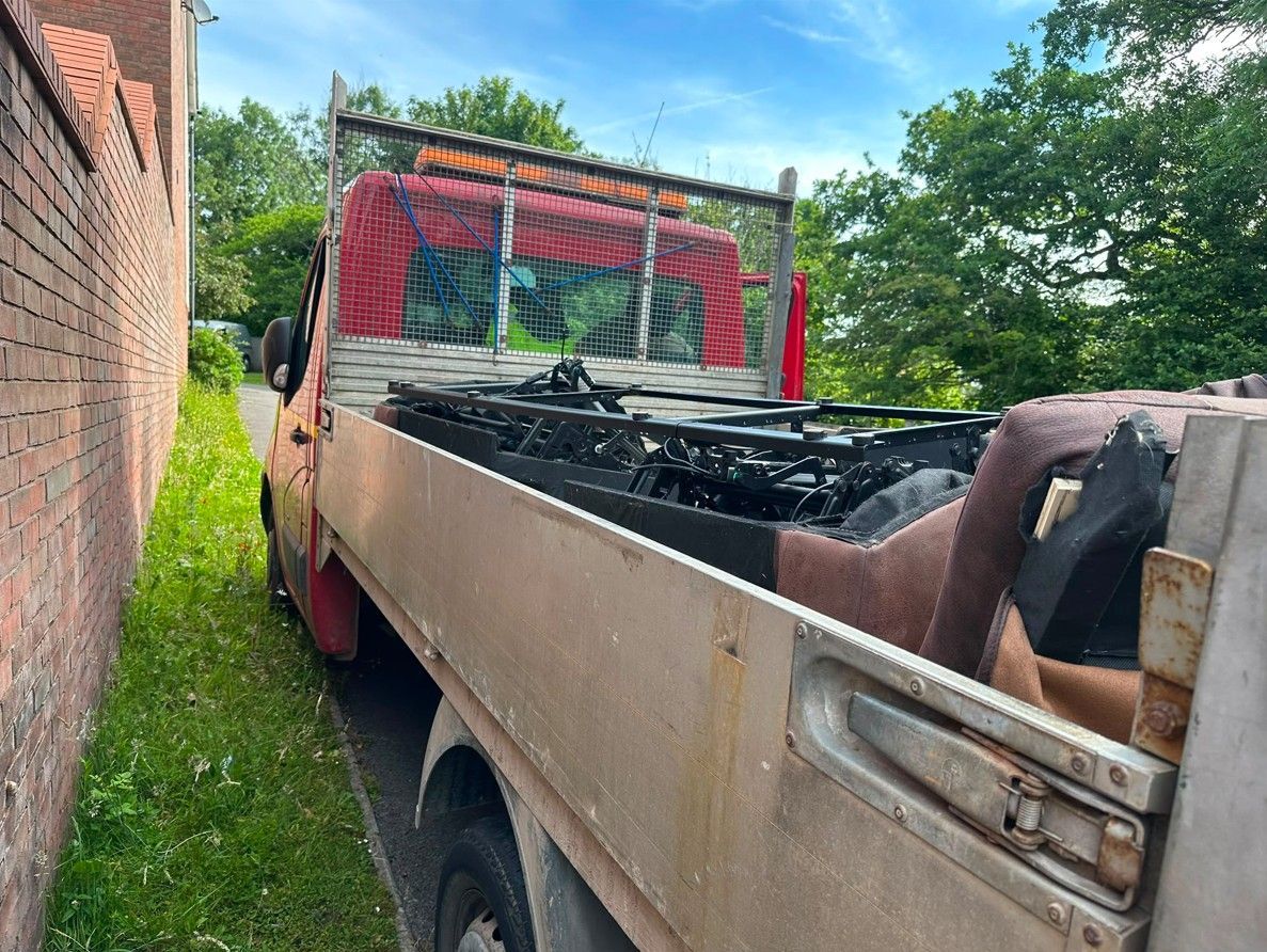 Sofa collection along with other bulky items loaded in J&Z House Clearance Cardiff's truck