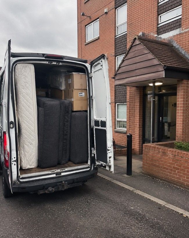 Van loaded outside a Cardiff apartment block during a flat clearance