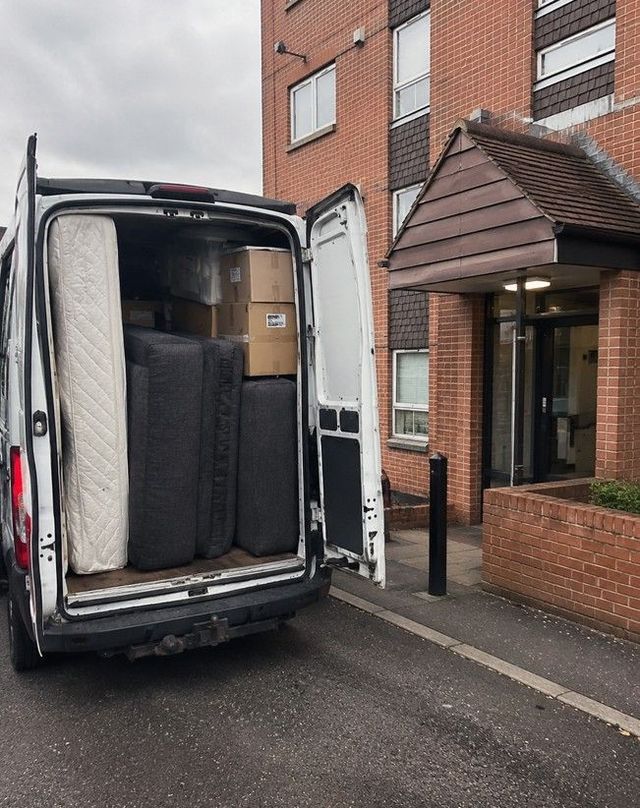 Van loaded outside a Cardiff apartment block during a flat clearance
