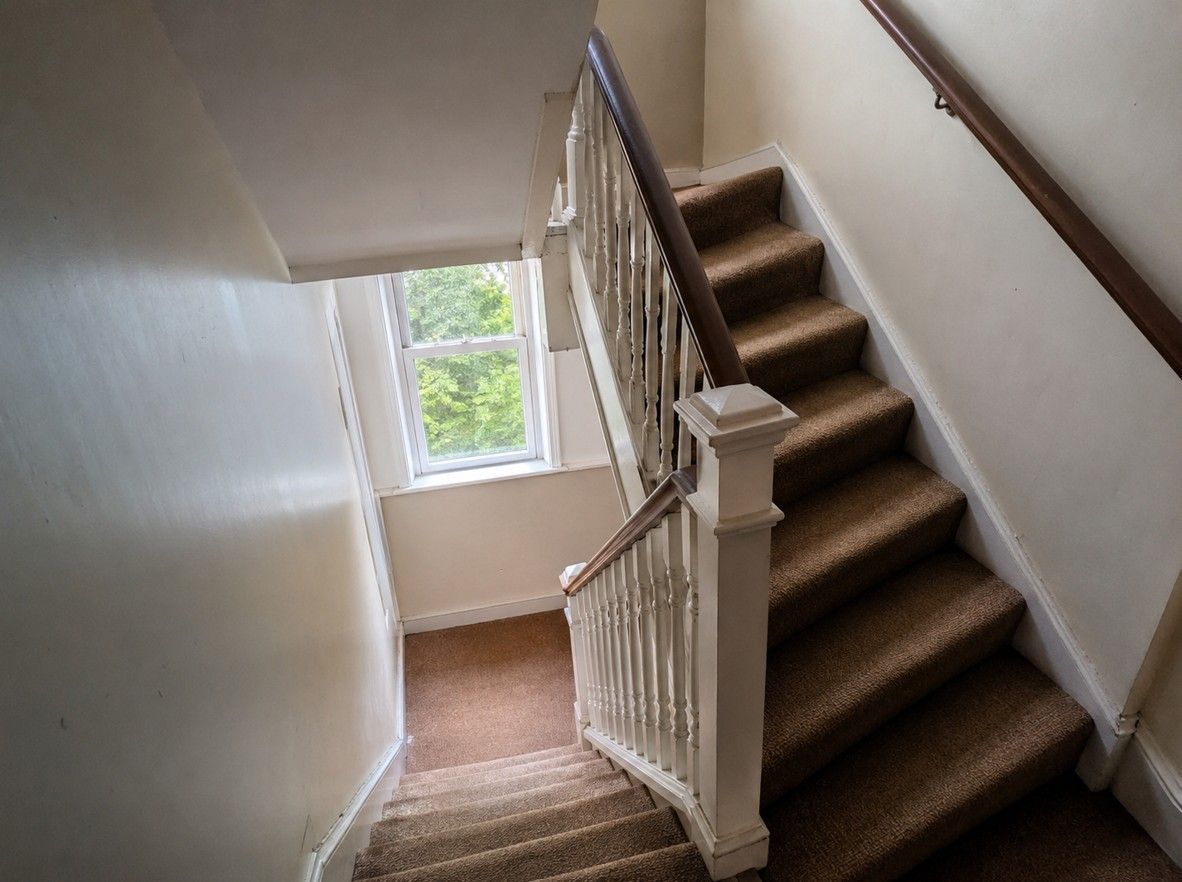 Narrow communal stairwell in a Cardiff converted flat