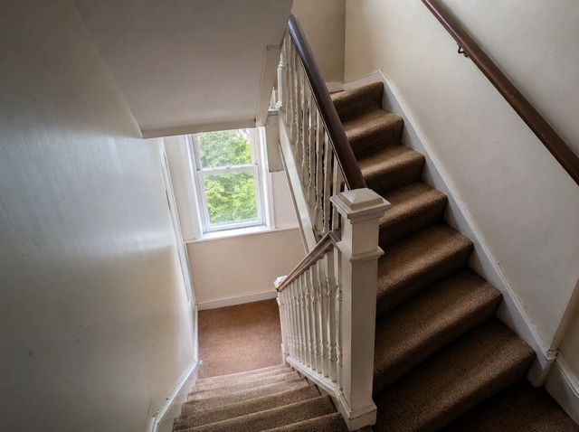 Narrow communal stairwell in a Cardiff converted flat