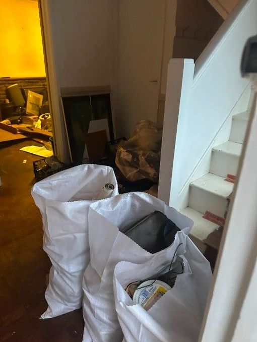 Items on the landing for collection as part of a house clearance in Cardiff